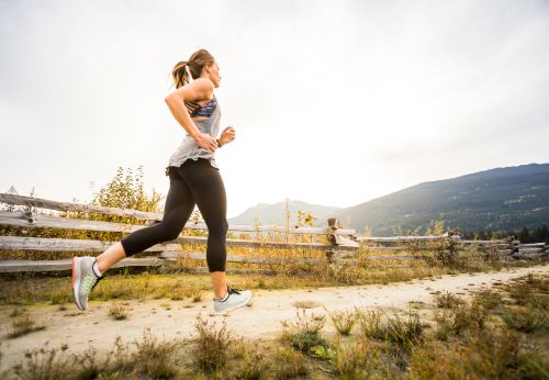 Woman running outside which can be a trigger for rosacea flare ups